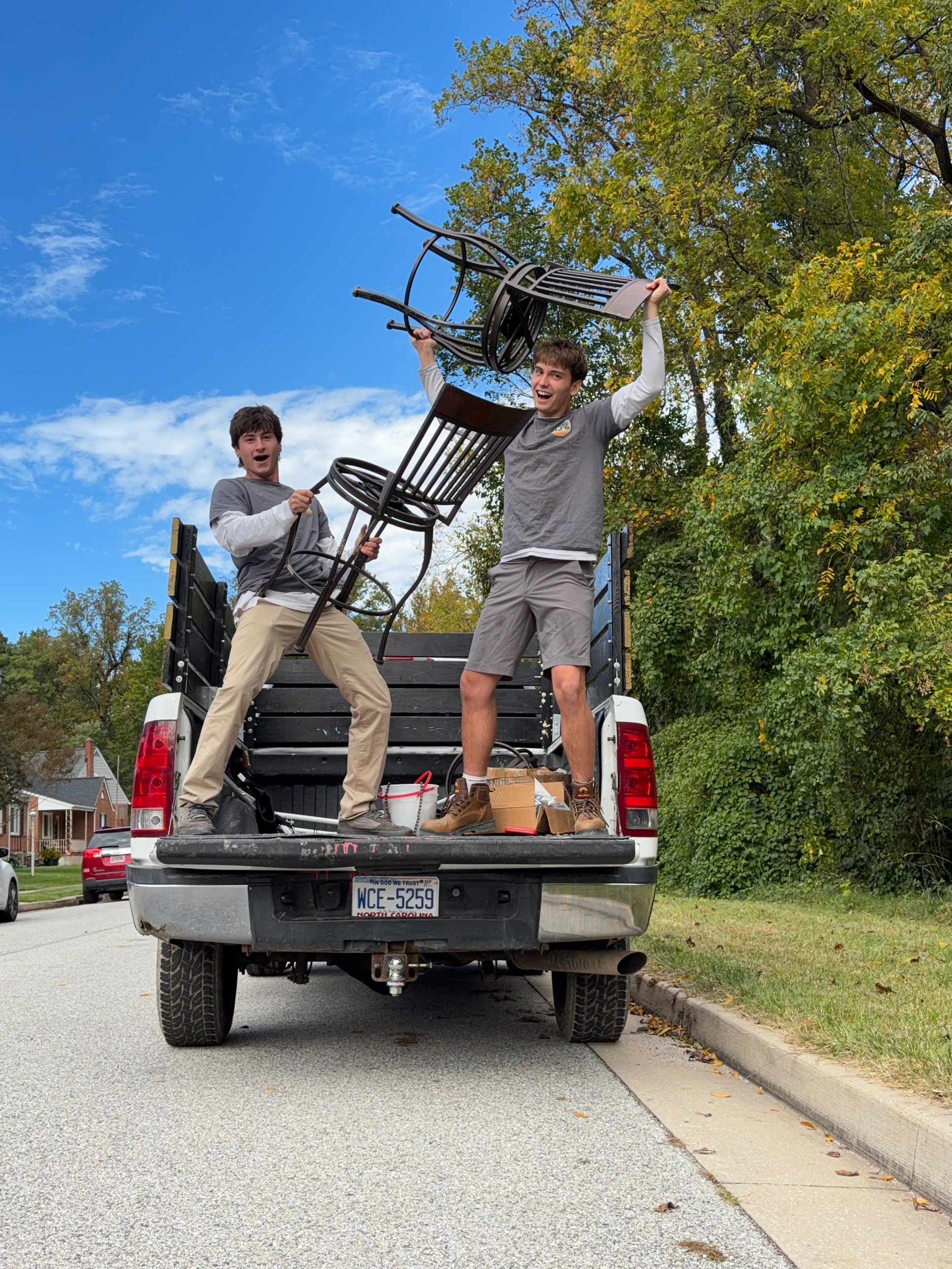 RJ's crew loading a chair into the truck, celebrating