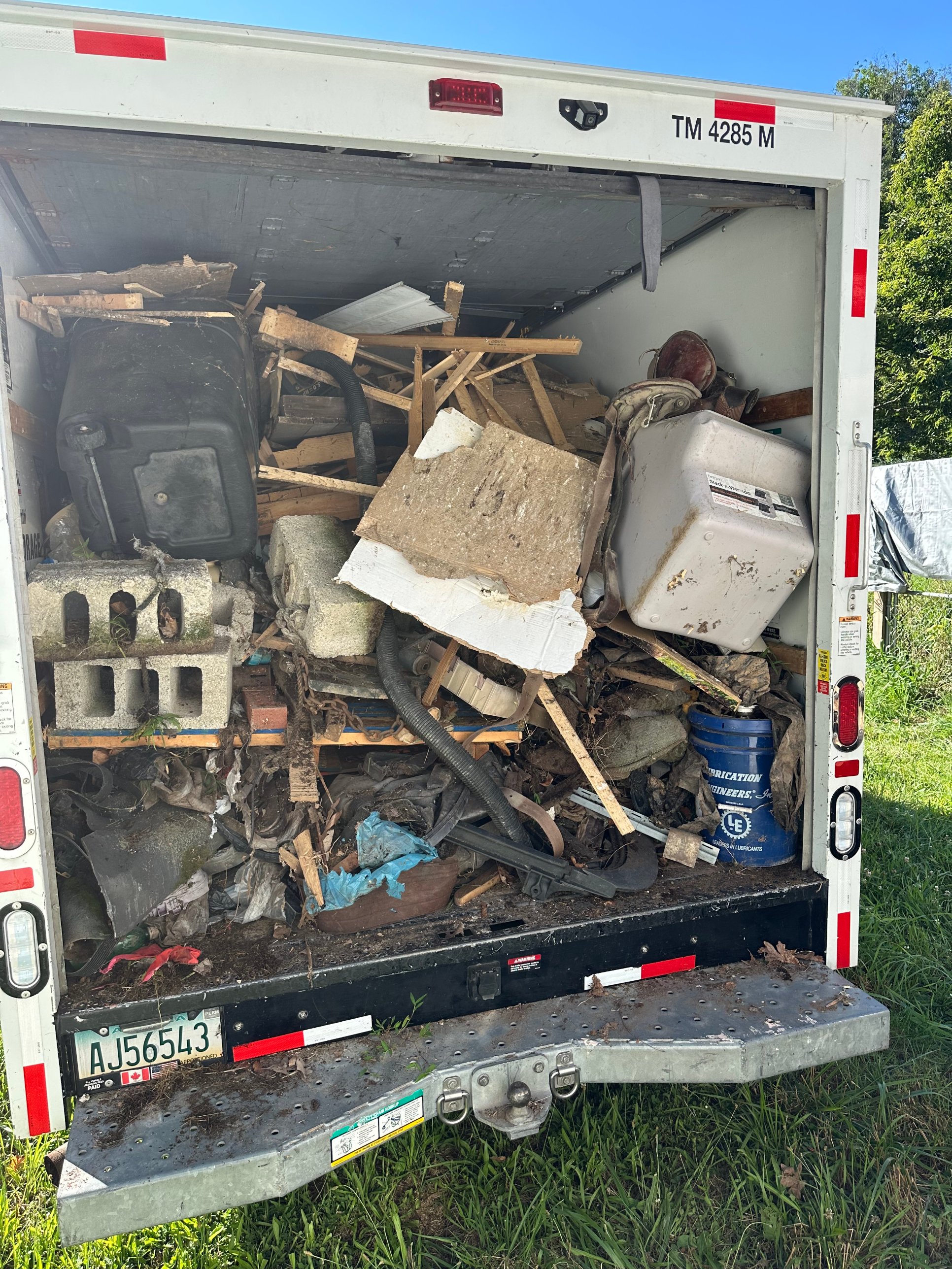 Truck fully loaded with construction debris and scrap